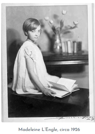 Madeleine L’Engle as a girl, around 1926, reading at a table